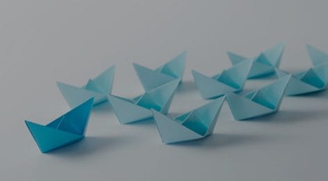 blue paper boats in a row with the words "Nutshell 16 sales Process templates for b2b pipelines"